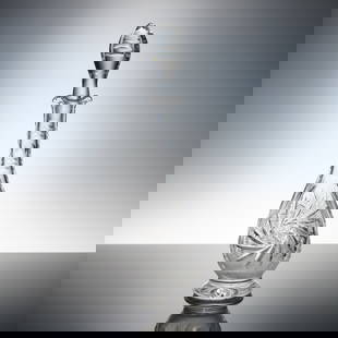 Bohemian Crystal Descanter with Stopper: Bohemian cut crystal decanter, featuring a gracefully tapered, of pear shaped form with deep geometric and fan cutting throughout. The clear body is embellished with radiating starburst and crosshatch