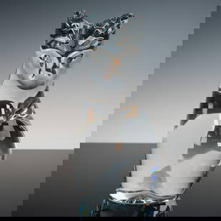 Daum France Clear Crystal Cat Sculpture: Stylized seated cat rendered in transparent Daum crystal, its elegantly elongated form abstracted into smooth, flowing planes that capture and refract the surrounding light. Subtle modelling around th