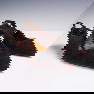 Prada Brown Suede Slingback Heels with Black Embroidery: This elegant pair of Prada slingback heels features a rich brown suede upper adorned with intricate black floral embroidery and a dainty front bow. The pointed toe silhouette is paired with a modest k