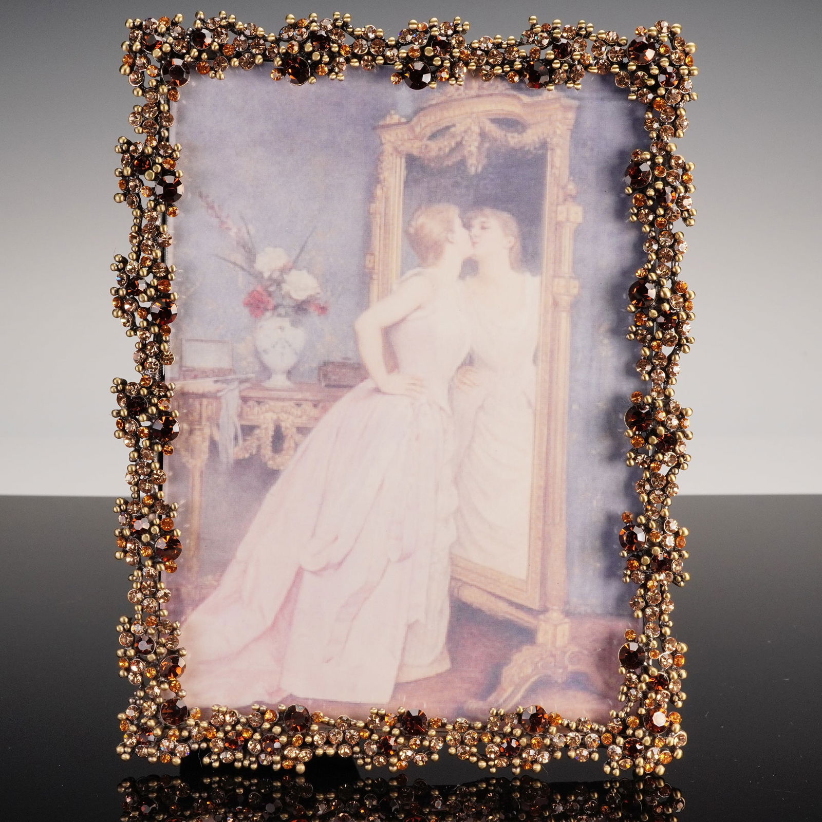 Rucinni Jeweled Crystal & Metal Picture Frame: An opulent decorative picture frame by Rucinni, exquisitely designed with a lavish border encrusted in an array of topaz, amber, and champagne-toned crystals. The frame's elaborate surface mimics clus