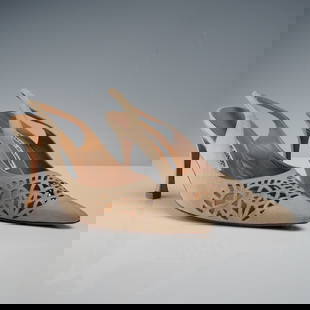 Manolo Blahnik Light Tan Suede Slingback Heels: This refined pair of Manolo Blahnik slingback heels features soft light tan suede with an intricate laser-cut geometric pattern across the vamp, creating a visually striking openwork design. The point