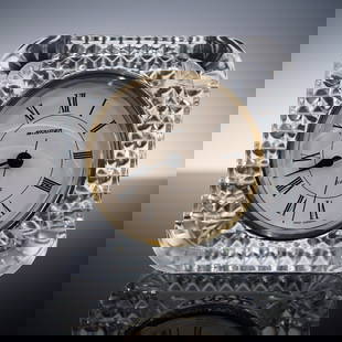 Stauer Quartz Crystal Desk Clock: Elegant Stauer desk clock encased in a cut crystal body with a diamond quilted pattern and rounded corners, featuring a white dial with black Roman numerals, black spade-style hands, and gold-tone bez