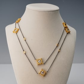Gold Tone and Dark Metal Station Necklace with Clear Stones