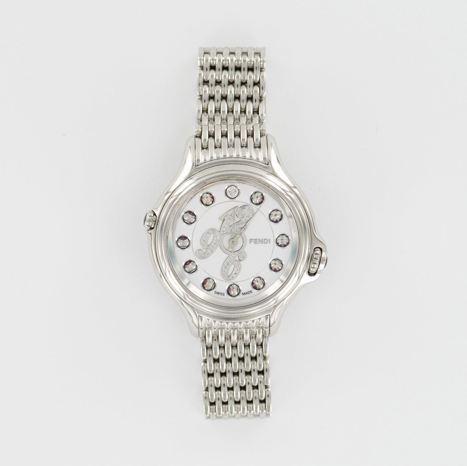 Fendi Crazy Carats Stainless Steel Ladies Watch with Box & Papers: Presenting a stunning Fendi Crazy Carats Ladies Watch - an elegant and innovative timepiece that exemplifies Italian luxury and Swiss craftsmanship. The watch features a polished stainless steel case