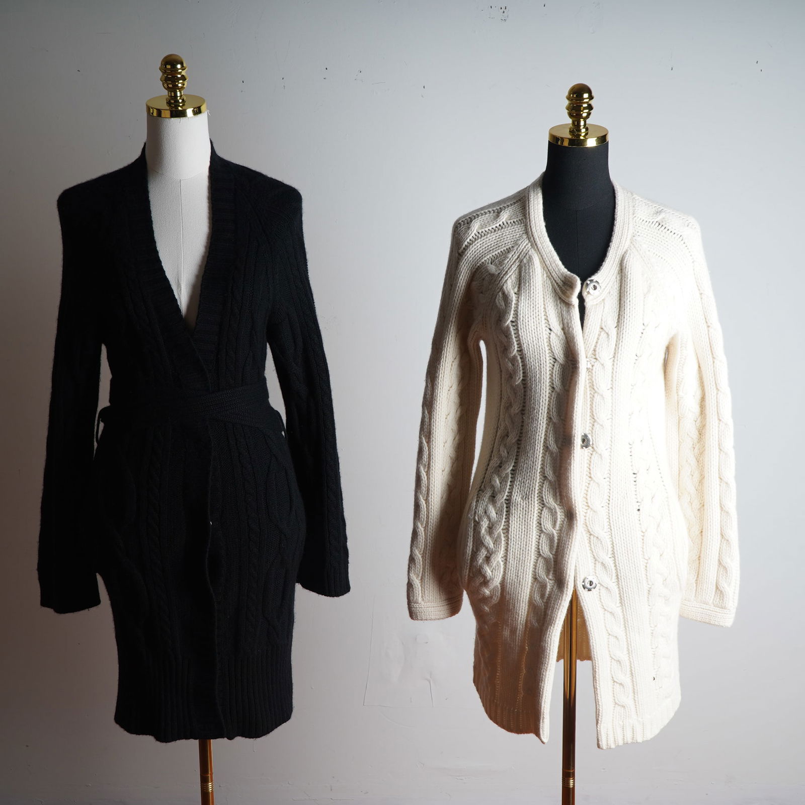 Two-Piece Designer Cable Knit Wool Cardigan Set: New Scotland and Malo: A luxurious two-piece cable knit wool cardigan set featuring one by New Scotland and one by Malo. The ivory cardigan by New Scotland is a longline, button-front design in a rich cable knit pattern wit