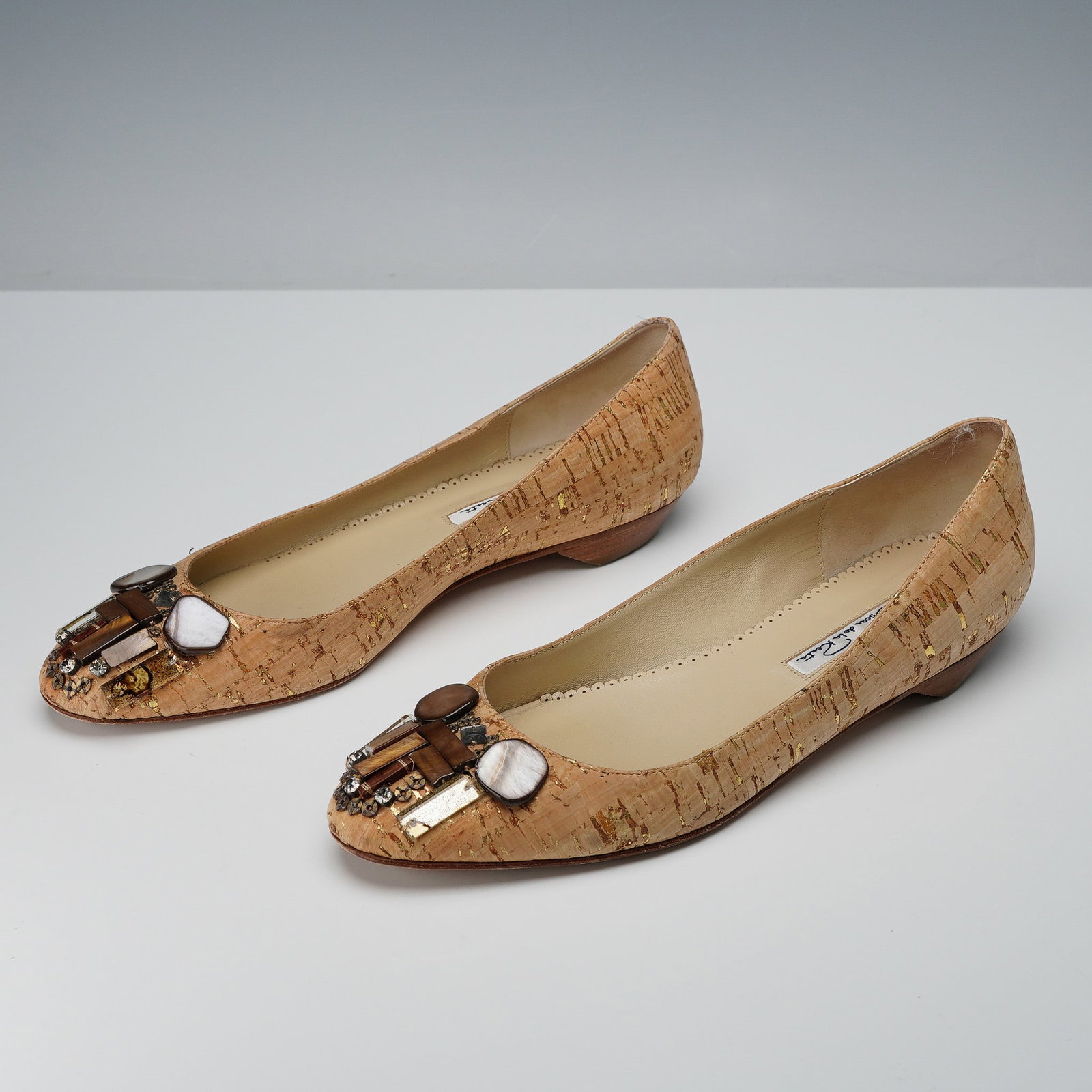 Oscar de la Renta Embellished Cork Flats with Jeweled Toe: This elegant pair of Oscar de la Renta flats features a distinctive cork upper accented with delicate gold flecks and an artfully embellished toe. The front of each shoe showcases a luxurious medley o