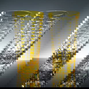 Pair of William Yeoward Crystal Lulu Yellow Highball Glasses: An opulent pair of highball glasses from the celebrated William Yeoward Crystal collection, showcasing the distinctive Lulu design. Masterfully hand-cut, these exceptional vessels feature a radiant ye