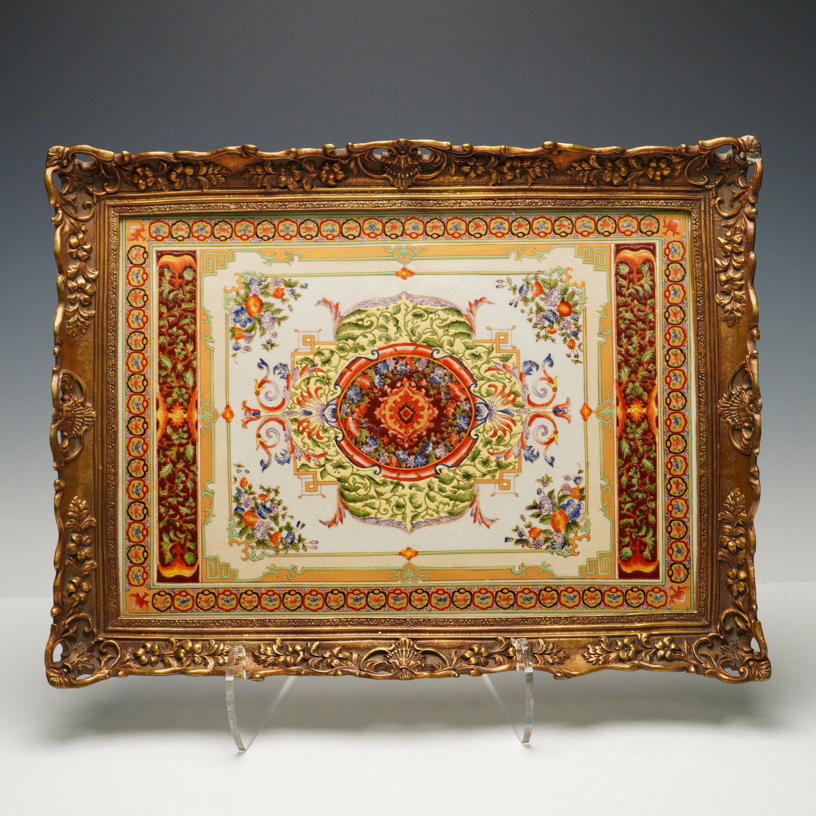Castilian Decorative Porcelain Tray with Ornate Relief Molded Border: A richly colored Castilian decorative porcelain tray featuring a central Persian-style medallion motif surrounded by floral and scroll patterns in vibrant hues. The tray is bordered by an ornate relie