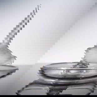 Lalique Crystal Ring Tray, Pheasant: A refined Lalique crystal ring tray featuring a delicately poised pheasant, its long tail sweeping skyward in a graceful curve. The frosted bird figure emerges from a smooth, circular dish with clear,