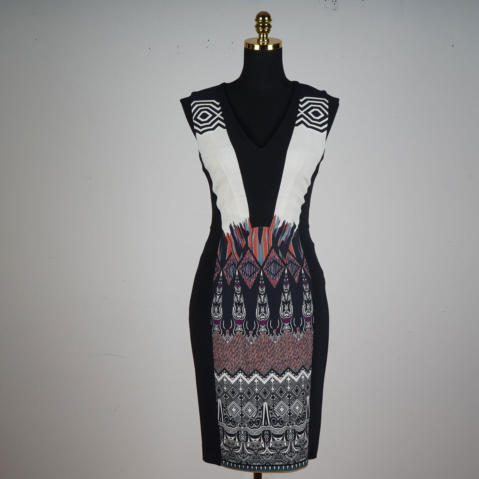 Etro Italian Bodycon Dress, Tribal-Inspired Print: Step into the spotlight with this stunning Italian-made Etro bodycon dress, crafted to flatter the silhouette with bold symmetry and dynamic design. This sleeveless, form-fitting piece features a deep