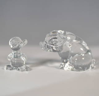 2pc Goebel Crystal Figurines " Pig & Duckling: A Goebel crystal figurine set featuring a pig and duckling, elegantly crafted in clear crystal. These charming sculptures showcase Goebel's expertise in glass artistry, with smooth, rounded forms that