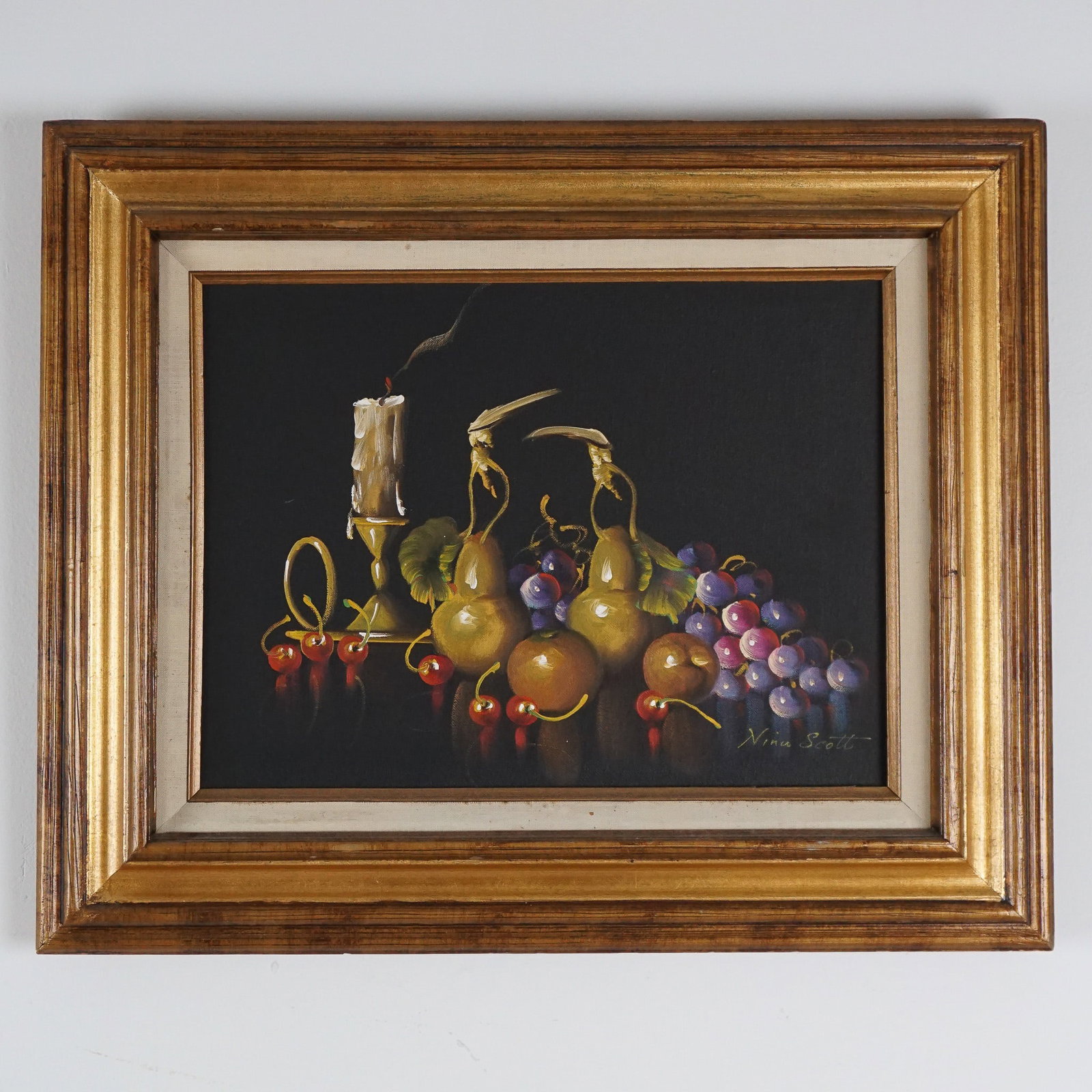 Nina Scott, Oil on Canvas, Still-Life, Signed: A beautifully executed still life painting by artist Nina Scott. This work features an intricate arrangement of golden pears, red cherries, and ripe purple grapes, accentuated by a burning candle and 