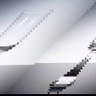 Baccarat Crystal Maladetta Glass with Box: An exquisite Baccarat Maladetta crystal glass, featuring a beautifully curved bowl atop a sculptural squared foot. This design showcases Baccarat's signature brilliance and precision cutting, perfectl