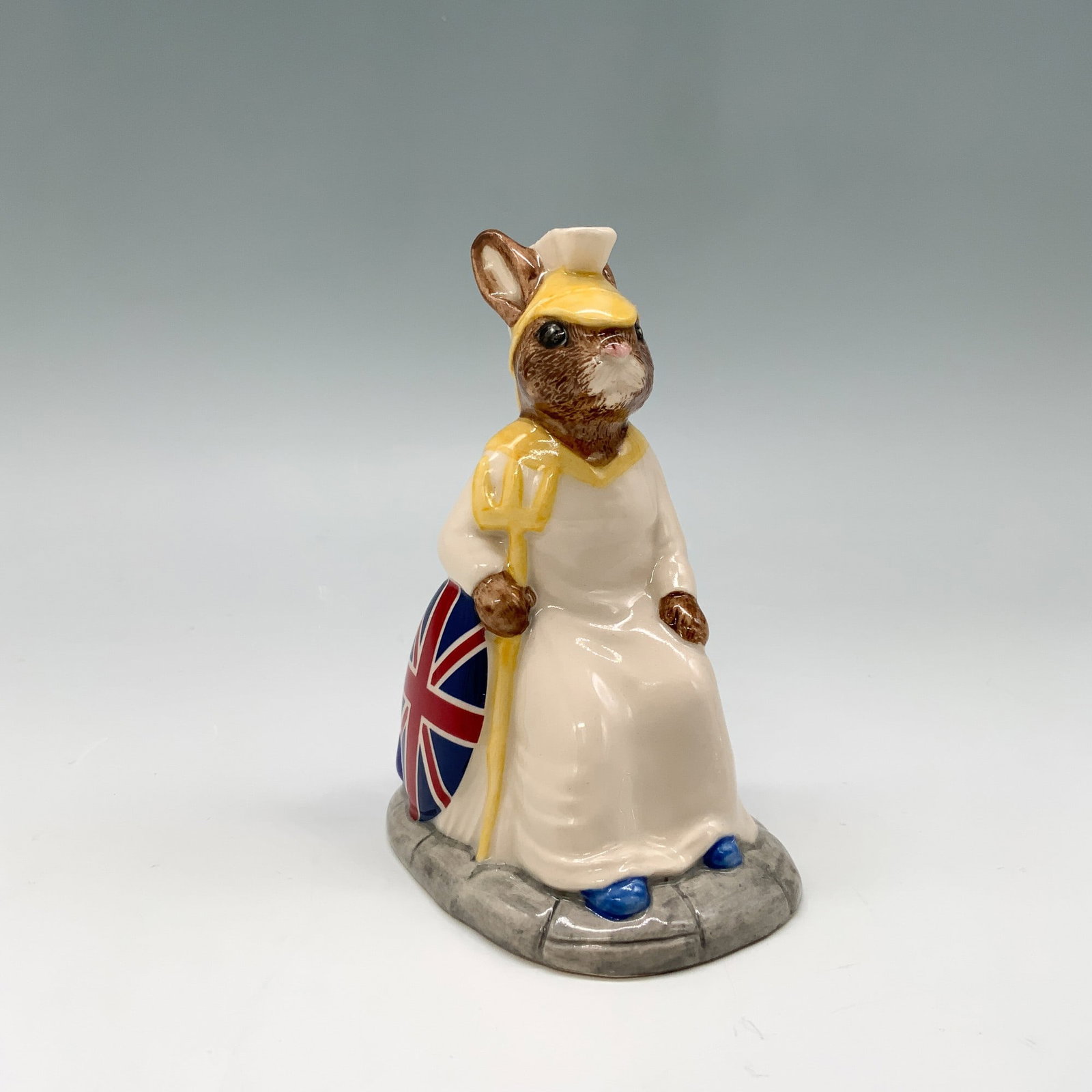 Royal Doulton Bunnykins Figurine, Britannia DB219 w/ Box: This delightful Royal Doulton Bunnykins figurine, titled Britannia, is part of a limited edition of 2,500 pieces, with this particular piece numbered 2,314. This figurine depicts a charming rabbit dre