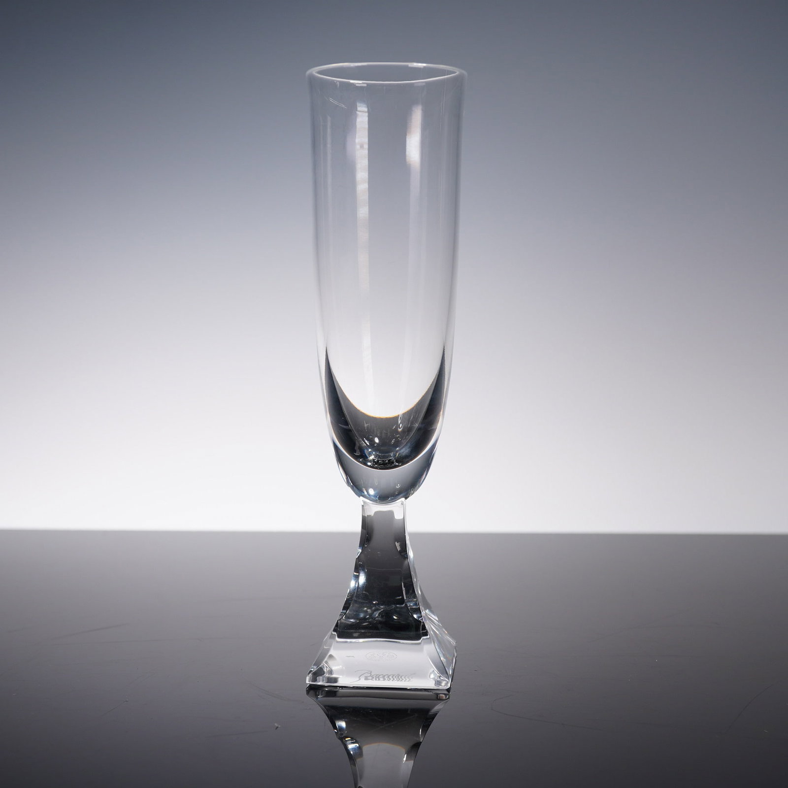 Baccarat Crystal Champagne Flute, Maladetta: Elegant Baccarat crystal champagne flute in the Maladetta pattern, featuring clean lines and a square foot with sharply faceted transitions. The tall, clear bowl offers a sleek silhouette balanced on 