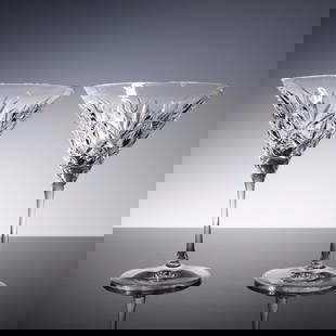 2pc Waterford Crystal Martini Glasses: A pair of elegant Waterford crystal martini glasses featuring a classic cut design that sparkles in the light. Each glass is etched with the Waterford mark on the base and comes in the original Waterf