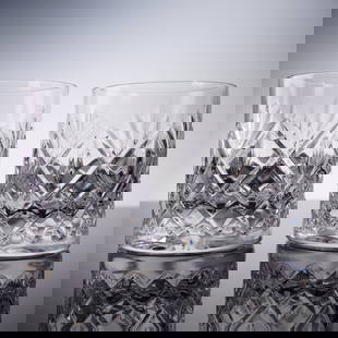 Pair of Waterford Crystal DOF Tumblers, Huntley: A fine pair of Waterford Crystal double old fashioned tumblers in the Huntley pattern. Featuring a bold crisscross and fan motif with a classic cylindrical form, these glasses are marked with the Wate