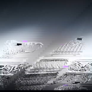 4pc Marquis by Waterford Crystal Tableware Set: A 4-piece Marquis by Waterford crystal set including a graceful Chevron cracker tray measuring 9.25"L, a finely cut napkin holder at 6"L, a Canterbury covered butter dish standing 7.25"H, and a matchi