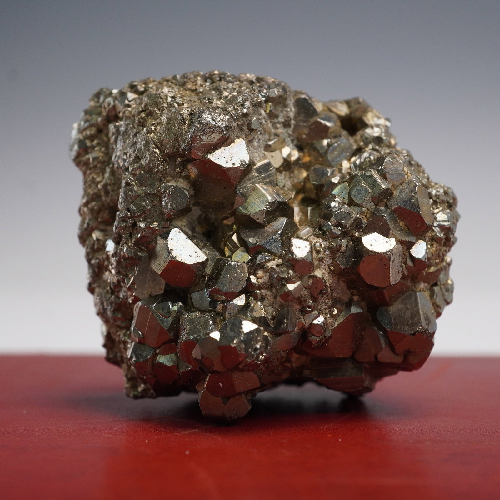 Natural Pyrite Crystal Specimen: Cluster of natural pyrite crystals with sharply defined cubic forms and a metallic luster. The specimen exhibits a mix of well-formed crystals and rough matrix, showcasing pyrite's brassy-gold color a