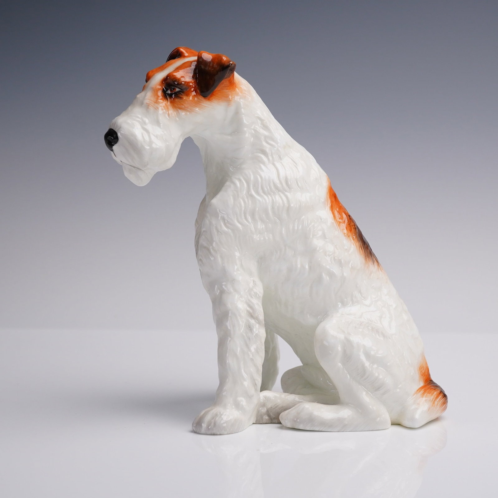 Royal Staffordshire Limited Edition Bone China Wire Fox Terrier Figurine: Finely modeled and hand-painted Royal Staffordshire porcelain figure of a seated Wire Fox Terrier, rendered in exquisite detail with crisp white and chestnut coloring and a high-gloss glaze finish. Pr