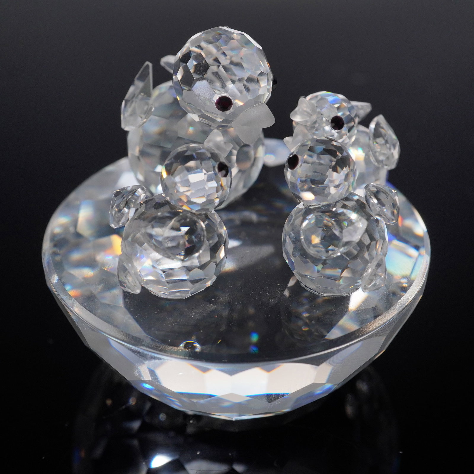 Swarovski Crystal Figurine, Bird's Nest, 13842: Add an enchanting piece to your crystal collection with this retired Swarovski "Bird's Nest" figurine. This delicate and charming design features two clear crystal baby birds nestled in a frosted crys