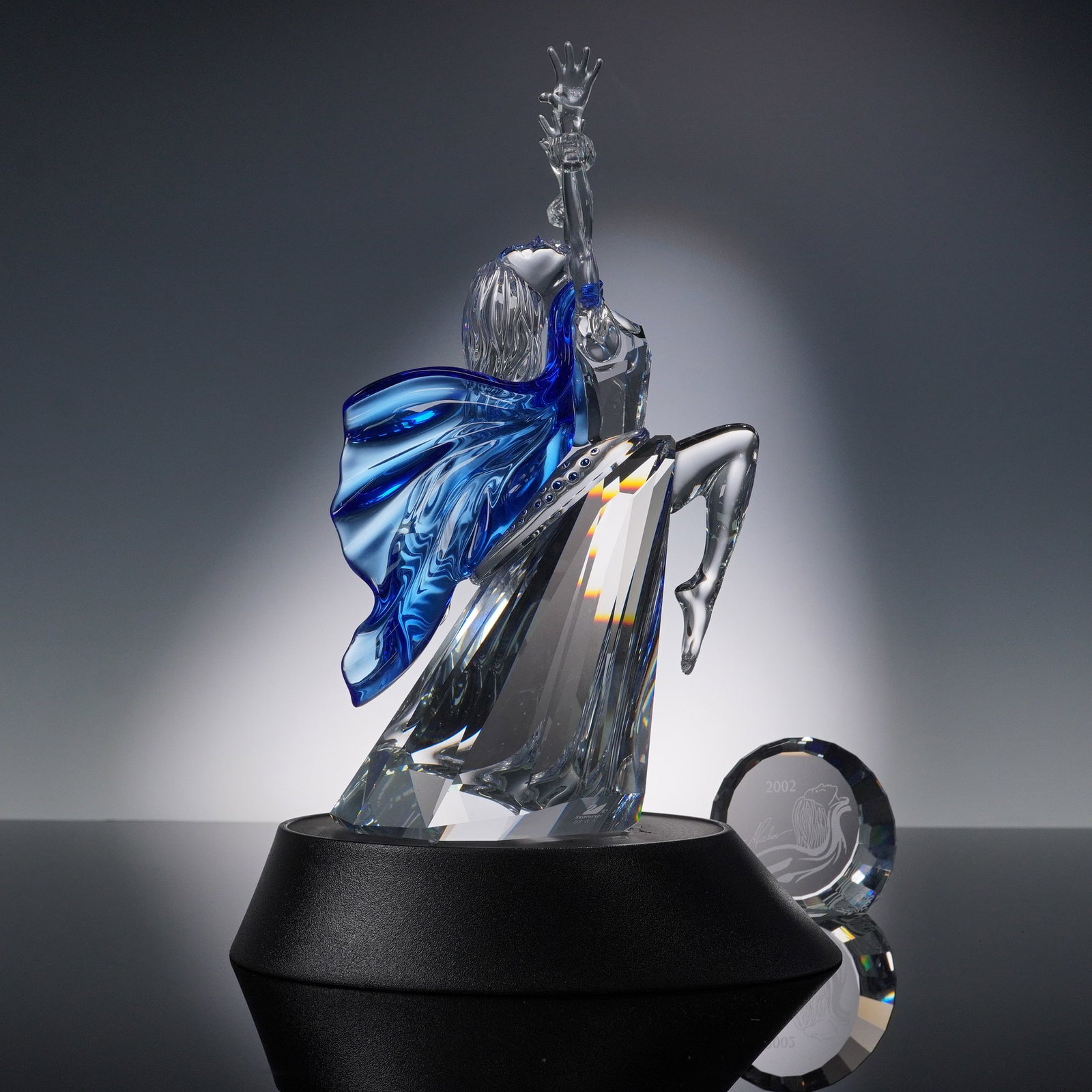 3pc Swarovski Crystal Figurine, Isadora, Plaque, and Base: This listing features the stunning Swarovski "Isadora" crystal figurine, the 2002 Annual Edition and the first piece in the Swarovski Crystal Society (SCS) "Magic of Dance" trilogy. Designed by Martin