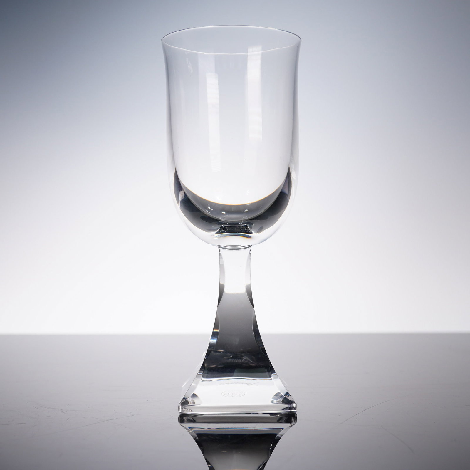 Baccarat Crystal Maladetta Glass with Box: An exquisite Baccarat Maladetta crystal glass, featuring a beautifully curved bowl atop a sculptural squared foot. This design showcases Baccarat's signature brilliance and precision cutting, perfectl