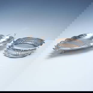 2pc Barker-Ellis Silverplate Wine Coaster and Leaf-Shaped Dish: An elegant pairing of silver-plated tableware, including a Barker-Ellis wine coaster and a decorative leaf-shaped dish. The round Barker-Ellis wine coaster is crafted in England, featuring an ornate p