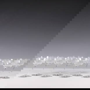 8pc Etched Crystal Coupe Glasses: A refined set of eight crystal coupe glasses featuring an elegant etched foliage motif encircling each bowl. These timeless glasses are perfect for serving champagne or cocktails, adding a sophisticat