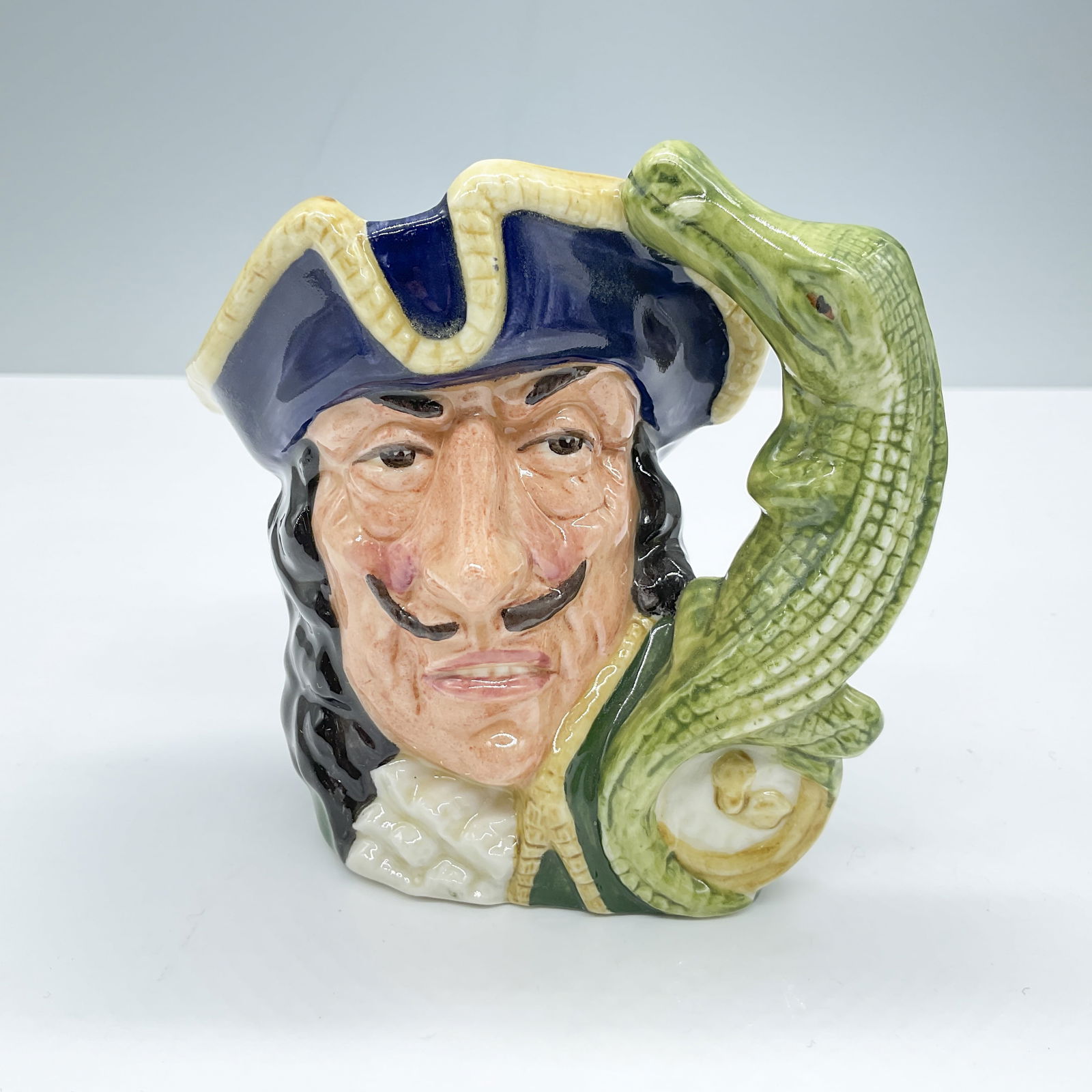 Capt Hook D6601 - Small - Royal Doulton Character Jug: Royal Doulton backstamp. Artist: Max Henk and David B. Biggs Issued: 1965 - 1971 Dimensions: 4"H Country of Origin: England
