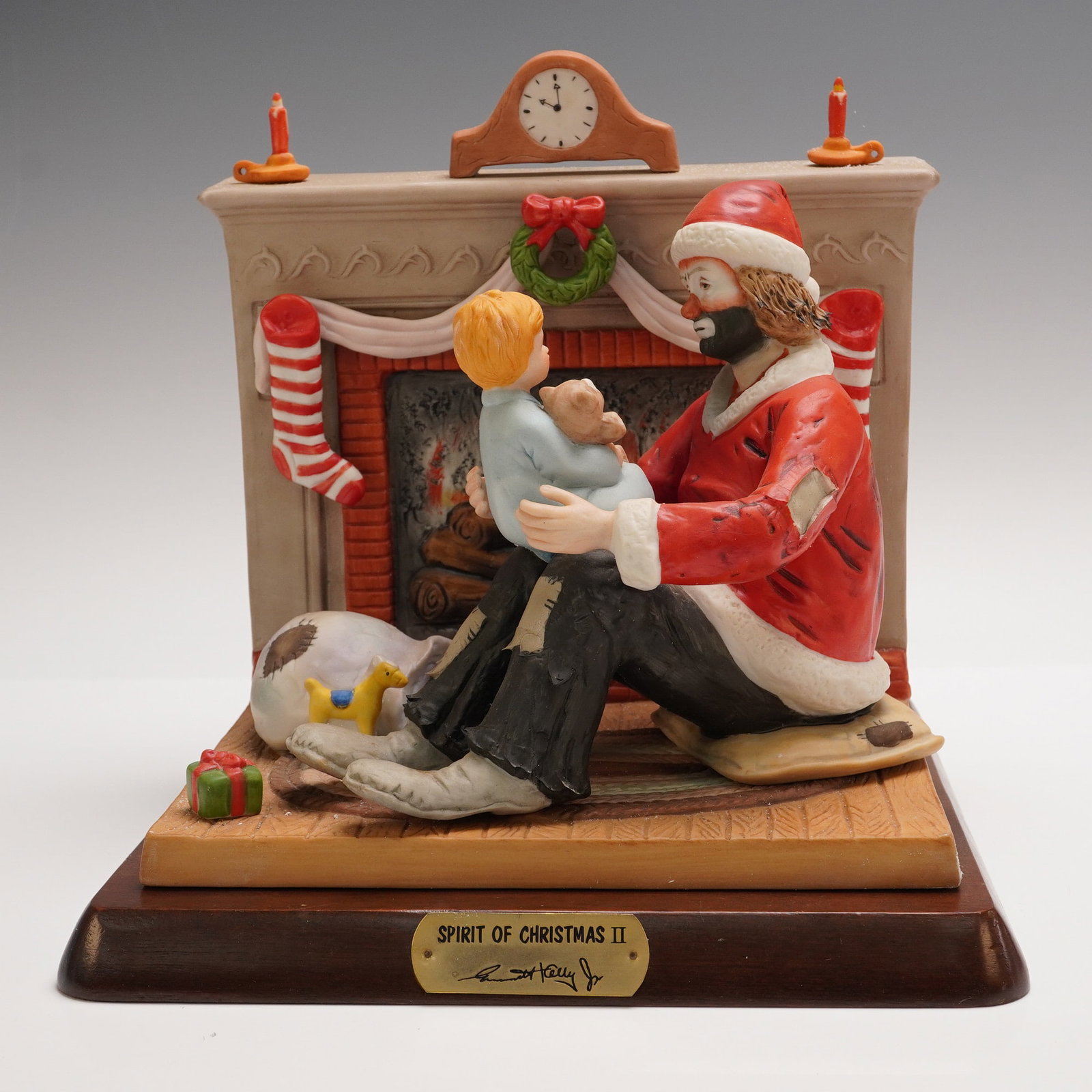 Flambro Emmett Kelly Jr. Figurine, Spirit of Christmas II: From the Emmett Kelly Jr. Collection exclusively by Flambro Imports, this limited edition figurine titled Spirit of Christmas II captures a tender holiday moment between the iconic clown and a young c