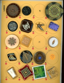 A card of assorted plastic buttons including Bakelite