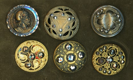 A small card of brass and cut steel buttons