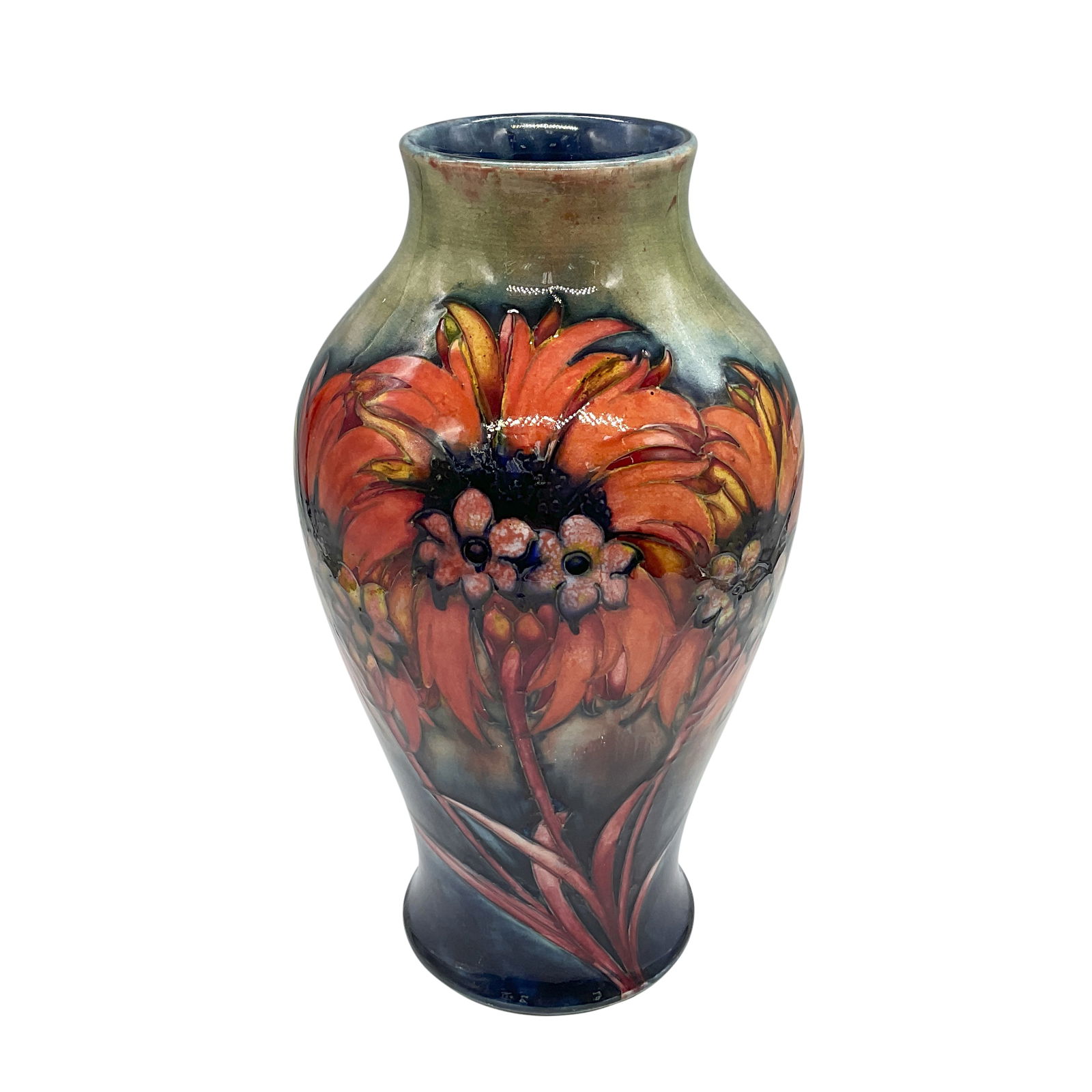 Moorcroft Flambe Pottery Vase, Revived Chrysanthemum Pattern: Baluster shaped porcelain vase decorated in with orange flowers, accented by faint tube-lining. Signed William Moorcroft, Made in England. Artist: William Moorcroft Issued: c. 1920s Dimensions: 7"W x