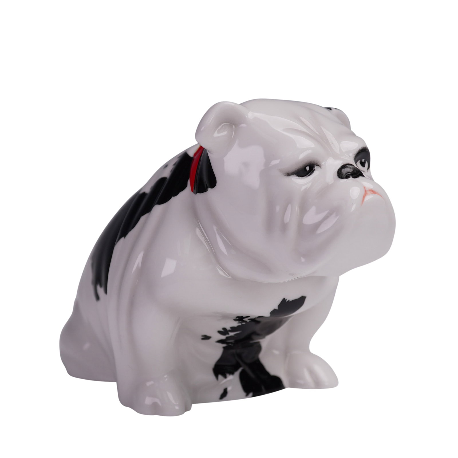 Royal Doulton Figurine Patch Bulldog DD002: This Royal Doulton figurine features Patch, a charming bulldog with bold black and white markings and a striking red collar. The craftsmanship captures the expressive face of the dog, with attention t