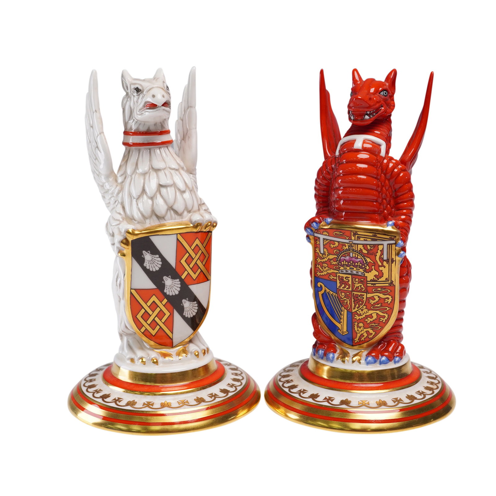 Pair of Minton Figurines, The Royal Wedding Heraldic Beasts: Pair of Minton bone china heraldic beasts issued to commemorate the wedding of His Royal Highness the Prince of Wales and Lady Diana Spencer on 29th July 1981. The set includes the Red Dragon of Wales