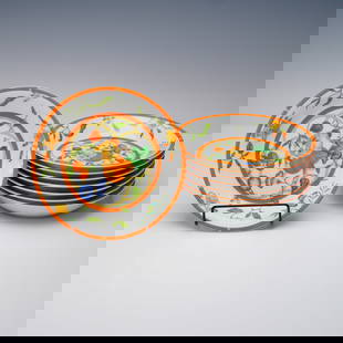 8pc Hermes La Siesta Porcelain Coupe Cereal Bowls: Colorful 8-piece set of coupe cereal bowls by Hermes in the "La Siesta" pattern. Each porcelain bowl features a vibrant central fruit and floral motif surrounded by scrolling greenery and butterflies,