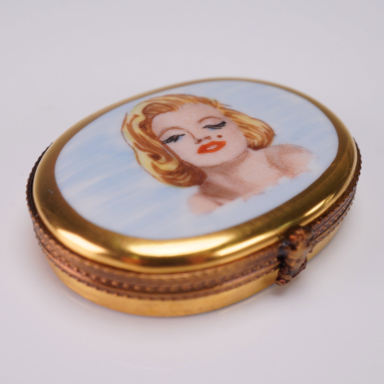 Limoges France Marilyn Monroe Porcelain Ring Box Limited Edition: Hand painted Limoges France porcelain box featuring a portrait of Marilyn Monroe on the lid, with a makeup palette interior inscribed Happy Birthday Mr. President, Marilyn. Marked Sinclair Limoges Fra