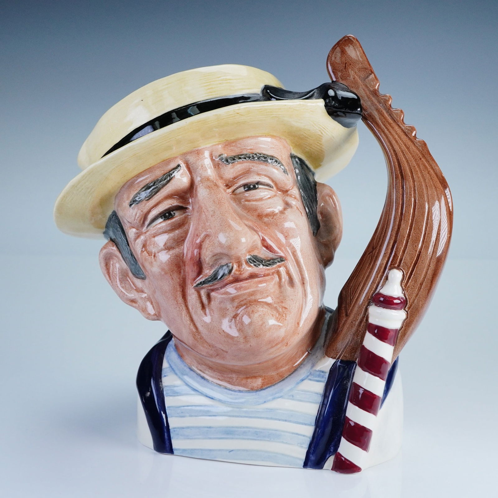 Royal Doulton Character Jug, Gondolier D6589: Large Royal Doulton character jug titled "Gondolier" D6589, designed by David B. Biggs and issued in 1964. This expressive ceramic jug features the face of a smiling Venetian gondolier wearing a straw
