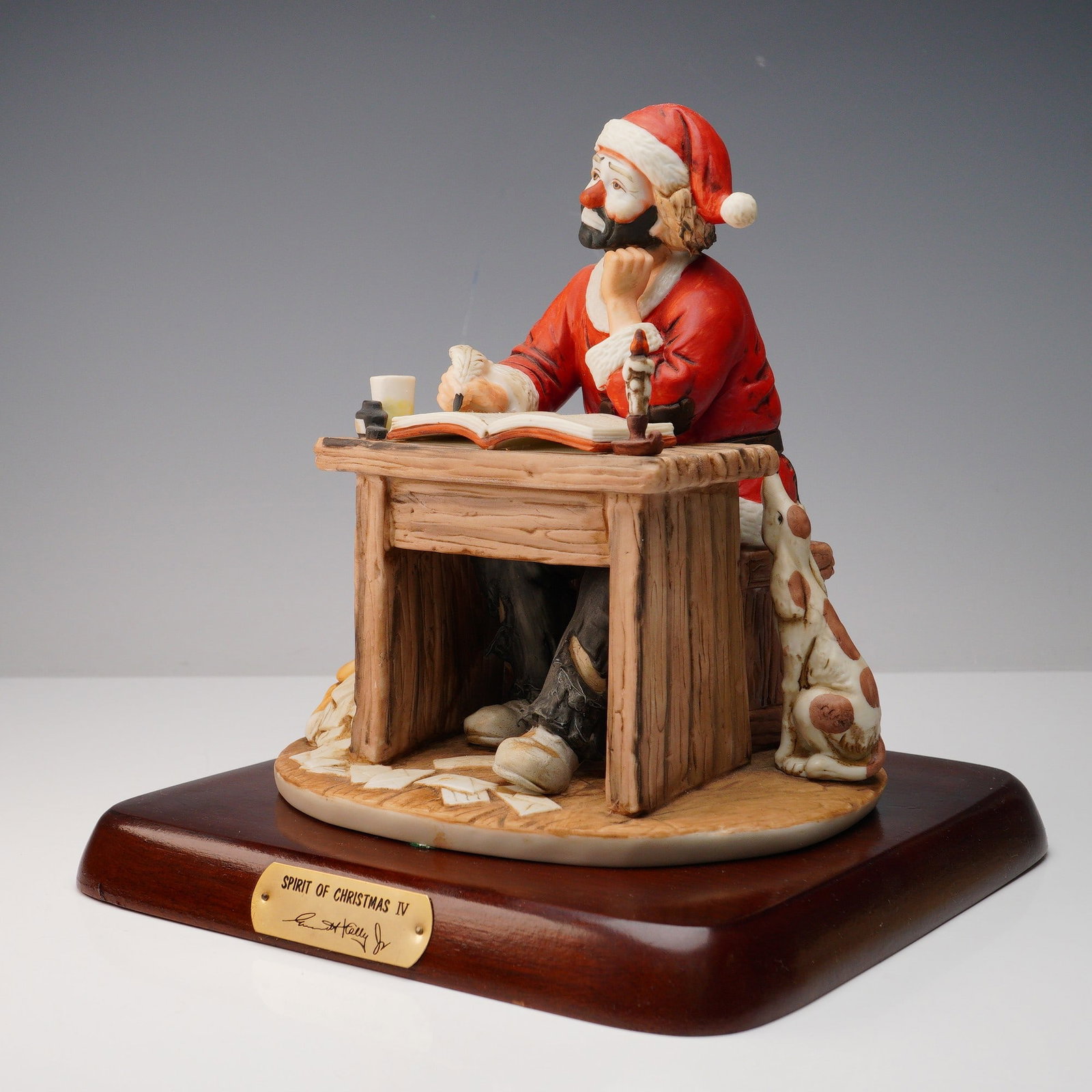 Flambro Emmett Kelly Jr. Figurine, Spirit of Christmas IV: Limited edition Emmett Kelly Jr. bisque porcelain figurine titled Spirit of Christmas IV, part of the Signature Collection by Flambro Imports. This hand-painted figure features the beloved clown chara