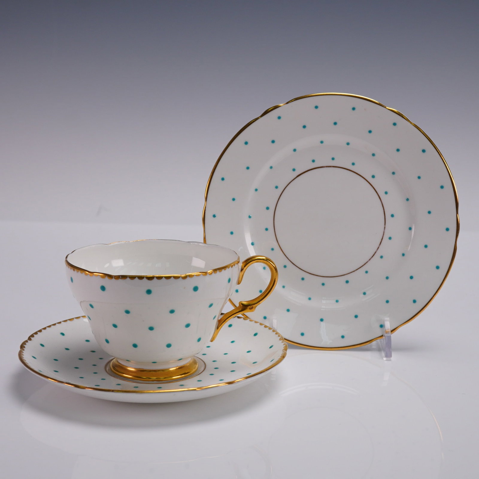 3pc Shelley England Teacup Saucer and Side Plate Polka Dot Set: Shelley fine bone china 3-piece set featuring a white ground with turquoise polka dots and hand-painted gold trim. Includes a flared teacup, matching saucer, and dessert plate, all marked Shelley Engl