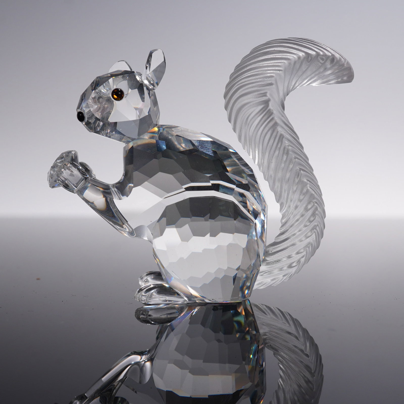 Swarovski Crystal Figurine, 10th Anniversary Squirrel: Swarovski Crystal Society 10th Anniversary Squirrel figurine, featuring a beautifully faceted clear crystal body with frosted accents on the tail and paws. Part of the SCS annual edition series, this 
