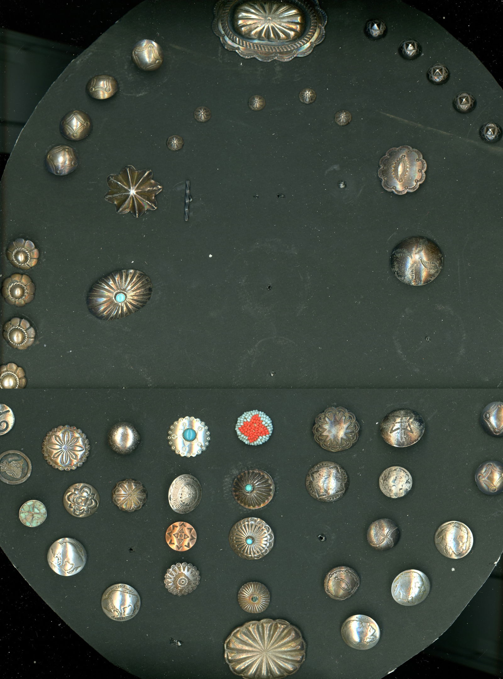 A large card of American Indian silver buttons: 53 Small-Medium-Large early 20th C. assorted examples. Here is a grand selection of nice Southwest Indian silver examples including turquoise OME, sets, and more. The lot also includes a nice beaded f