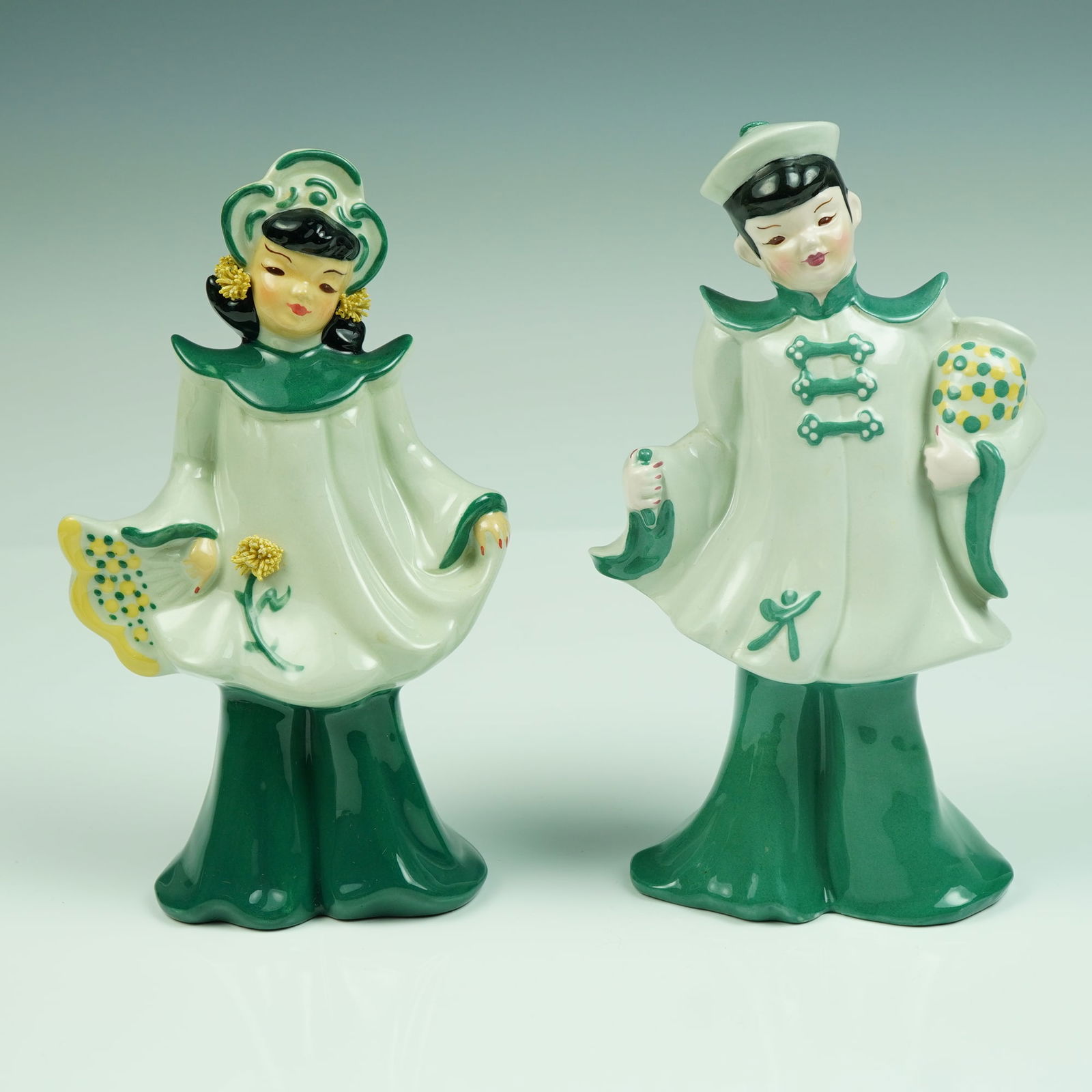 Florence Ceramics Asian-Inspired Couple Figural Vases: Step into the golden age of California pottery with this striking pair of Florence Ceramics figural vases, beautifully capturing mid-century artistry with a flair for the exotic. Handcrafted in Pasade