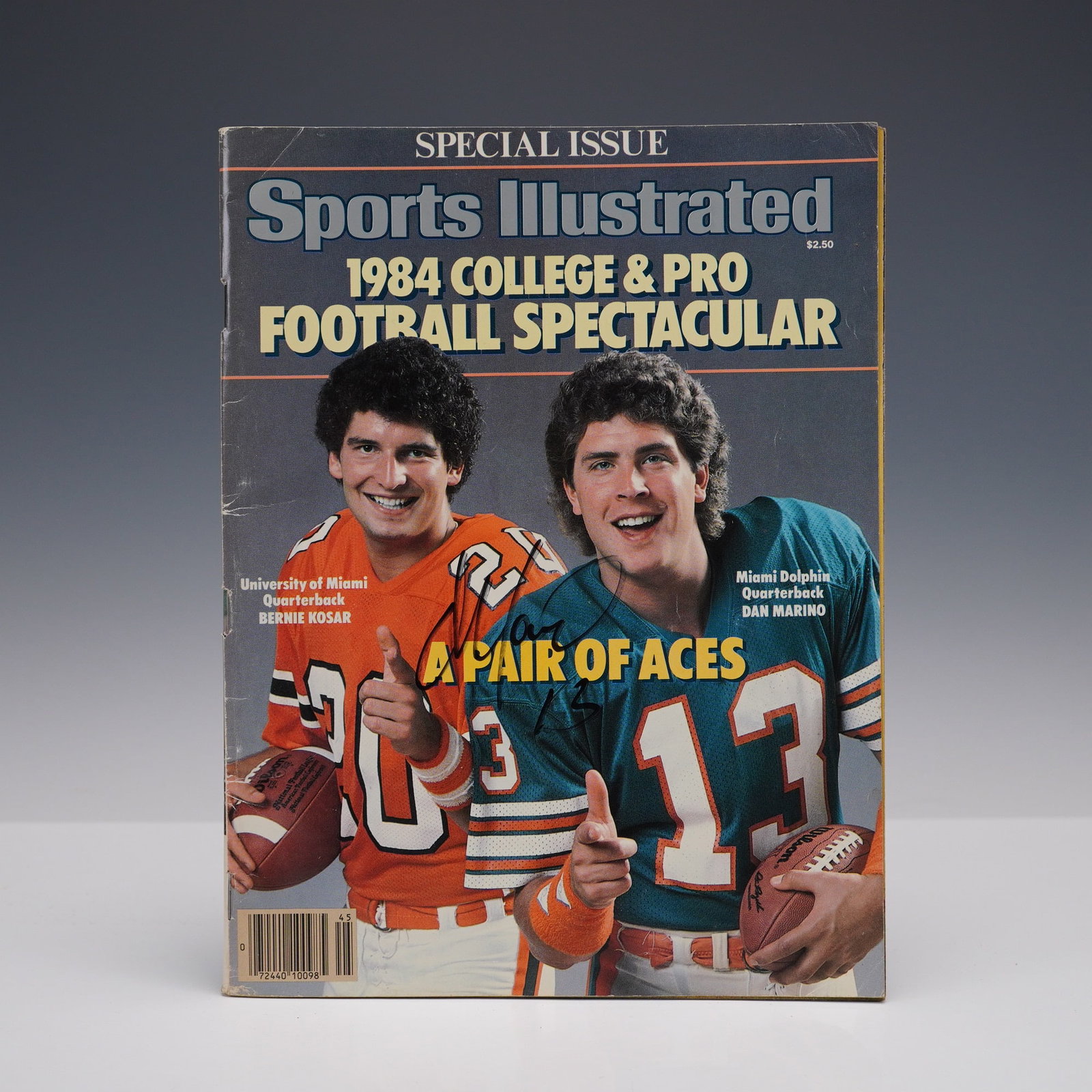 Dan Marino Signed Sports Illustrated - 1984 Football Spectacular: A vintage Sports Illustrated "1984 College & Pro Football Spectacular" special issue, featuring University of Miami quarterback Bernie Kosar and Miami Dolphins quarterback Dan Marino on the cover. Tit