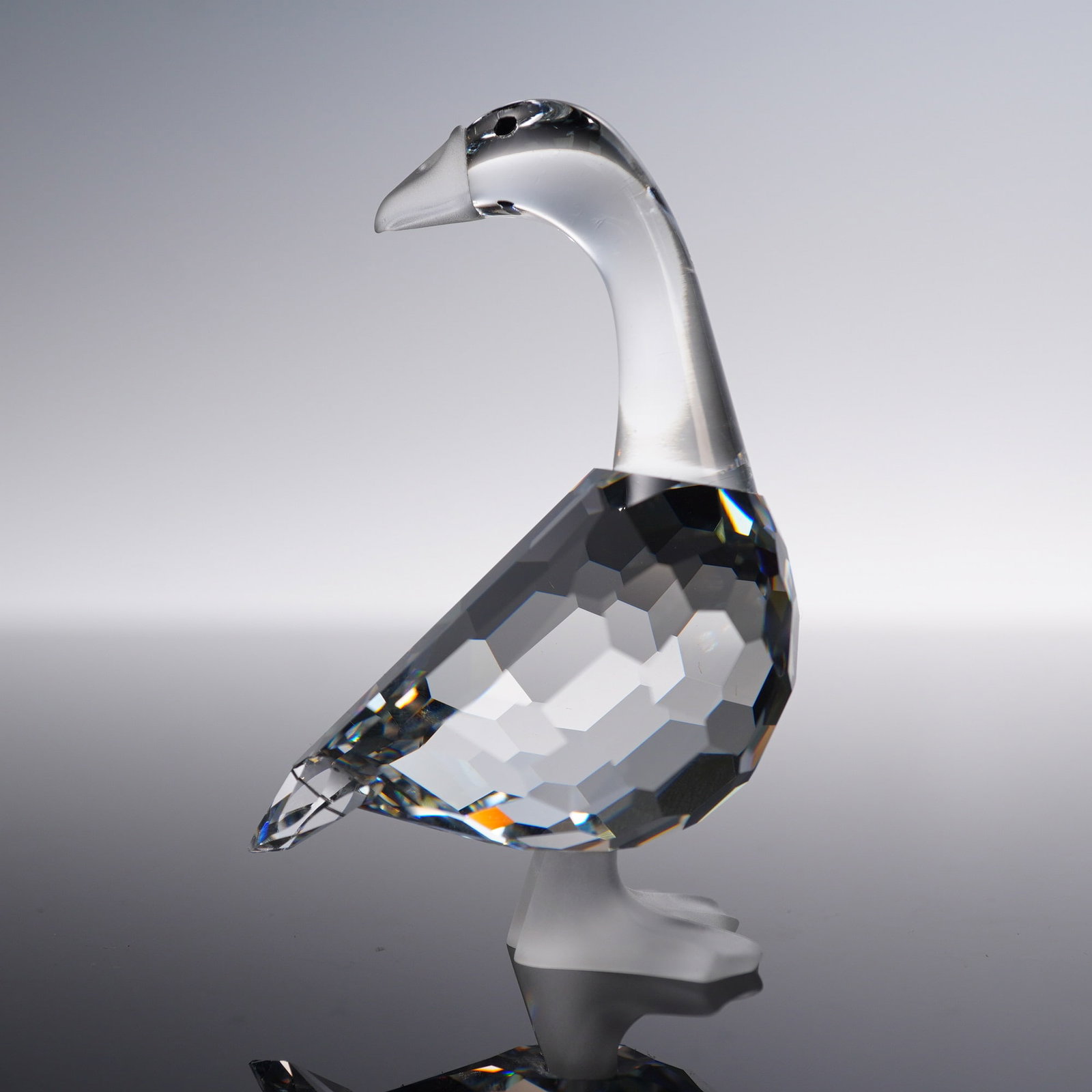 Swarovski Crystal Figurine, Goose Mother: Swarovski Silver Crystal figurine titled Goose Mother, featuring a clear faceted crystal body with a frosted beak and feet. Part of the Silver Crystal collection, this charming piece was crafted in Au