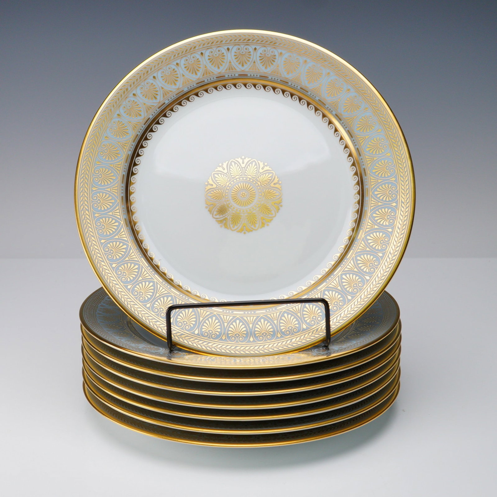 8pc Royale France Salad Plates, Elysee: Set of eight porcelain salad plates by Royale, in the Elysee decor. Each plate features a central gold medallion and a richly detailed neoclassical border in gilt. This pattern is a reissue of the ori