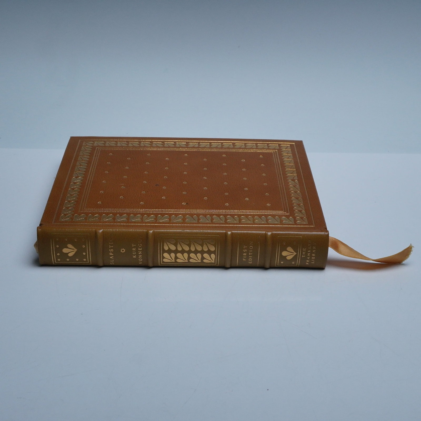 Slapstick or Lonesome No More, Kurt Vonnegut, Franklin Library: A fine leather-bound first edition of Slapstick or Lonesome No More by Kurt Vonnegut, published by The Franklin Library for the First Edition Society, 1976. Bound in full brown leather with elaborate 
