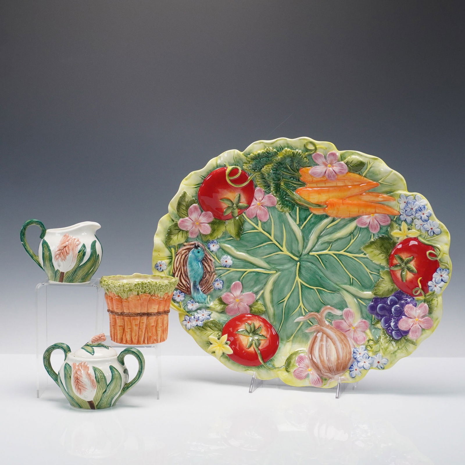 5pc Fitz and Floyd Country Chic Ceramic Serveware: A colorful four-piece ceramic serveware set from Fitz and Floyd's Country Chic collection, featuring hand-painted vegetable and floral motifs in vibrant relief. The grouping includes one large oval pl