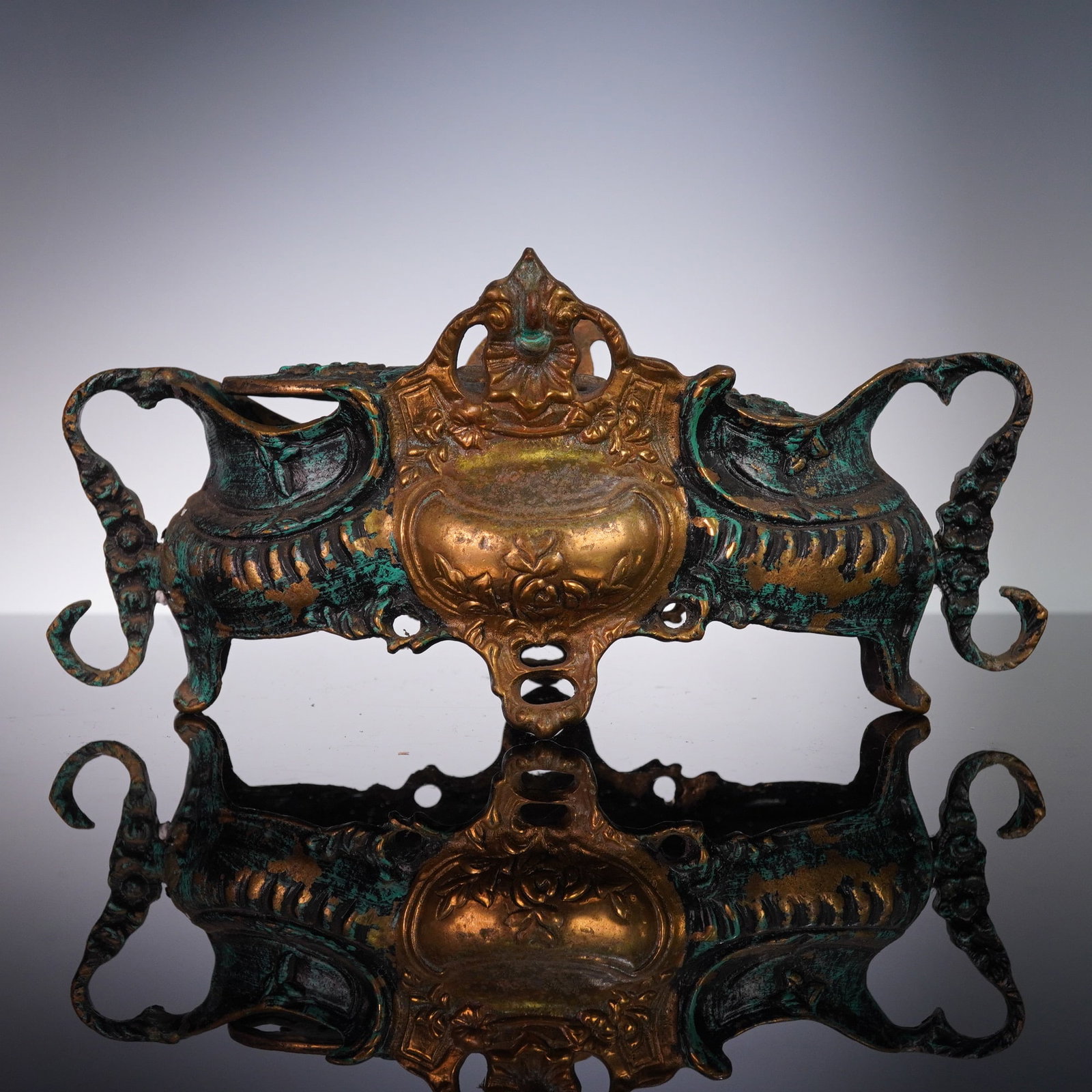 Antique French Art Nouveau Gilt Bronze Jardiniere with Pierced Insert: This elegant French Art Nouveau jardiniere exhibits all the hallmarks of the period's flowing organic design. Cast in gilt bronze, the piece features ornately scrolling handles, paw feet, and raised r
